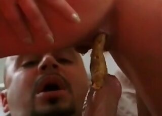 Riding his cock which is covered in the feces