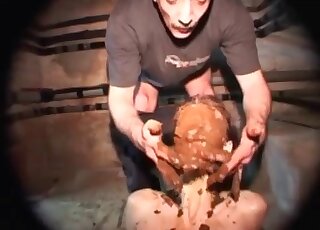 Two perverted men are working together in a scat threesome